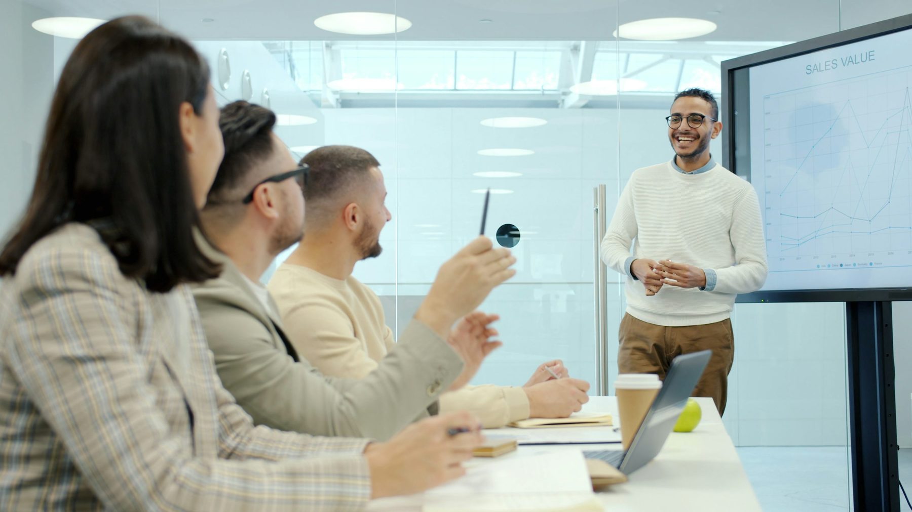 Graduate walking through portfolio work during a discussion