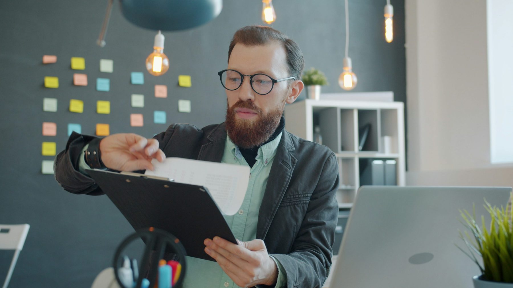 Person reviewing a budget and payment options at a kitchen table
