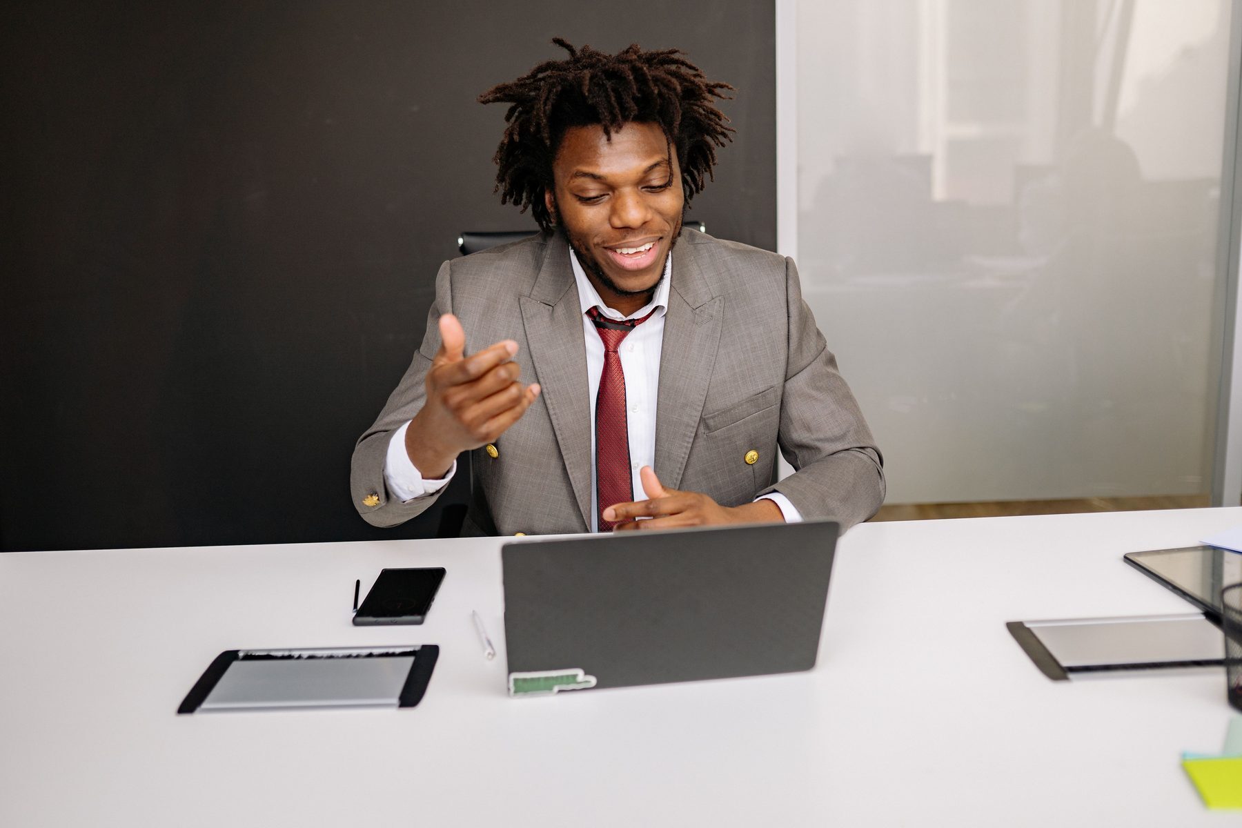 Professional taking notes during a live online class at home